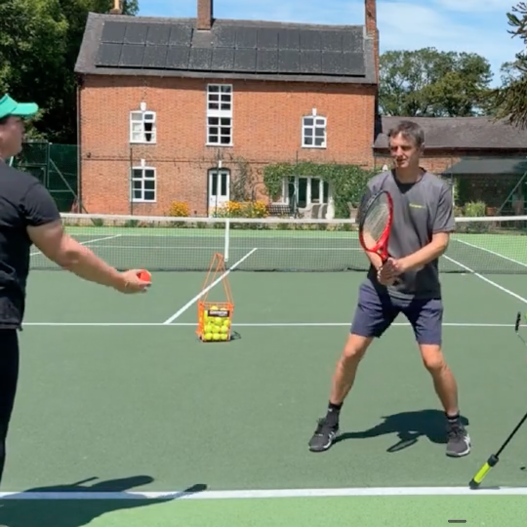 Forehand drill with tennis student