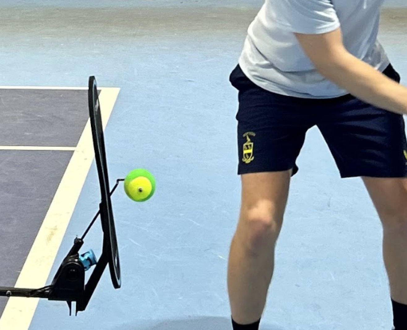 Player using the SpinPro screen to practise the correct racket angle